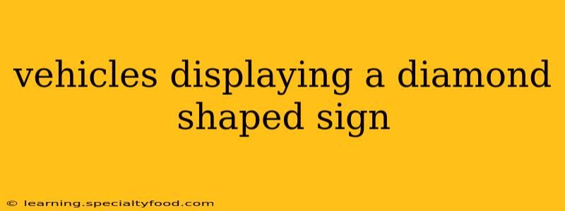 vehicles displaying a diamond shaped sign
